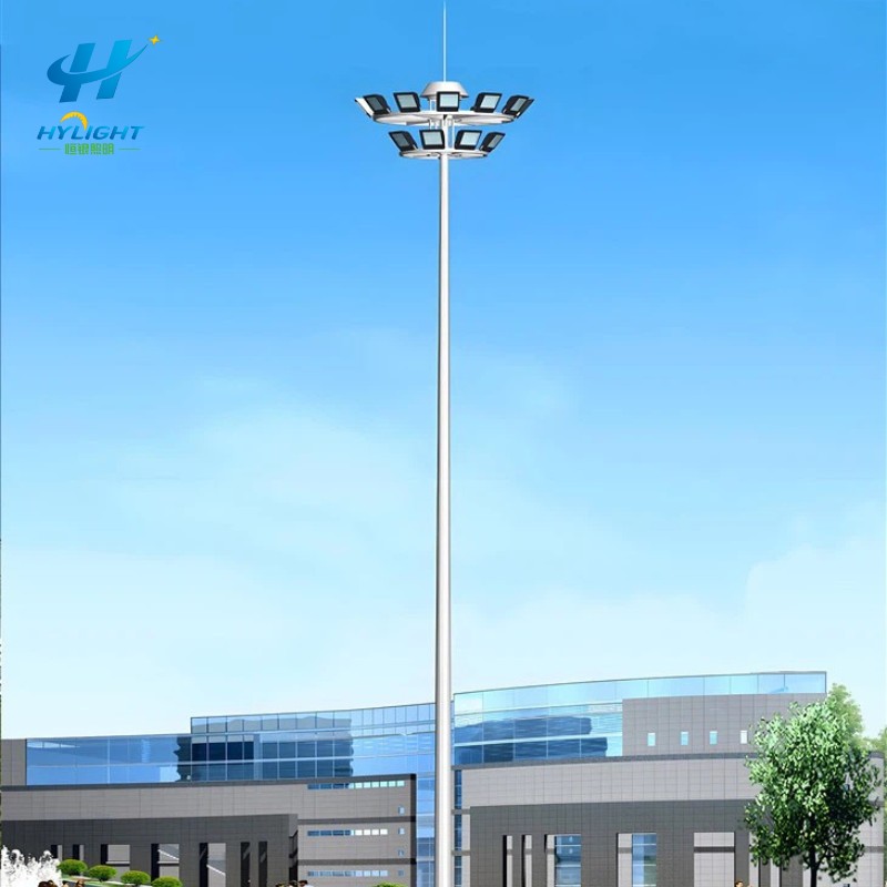 high mast with raising lowering system for outdoor lighting maintenance