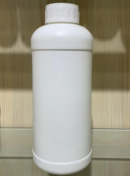Liquid dispensing bottle