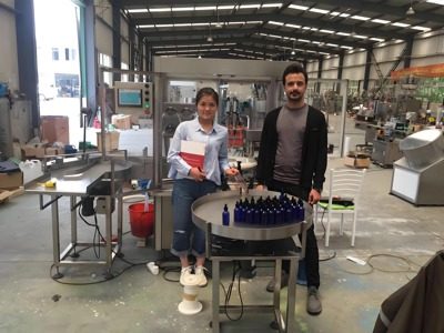 Customers pose for a photo in Yangbang Machinery's workshop.