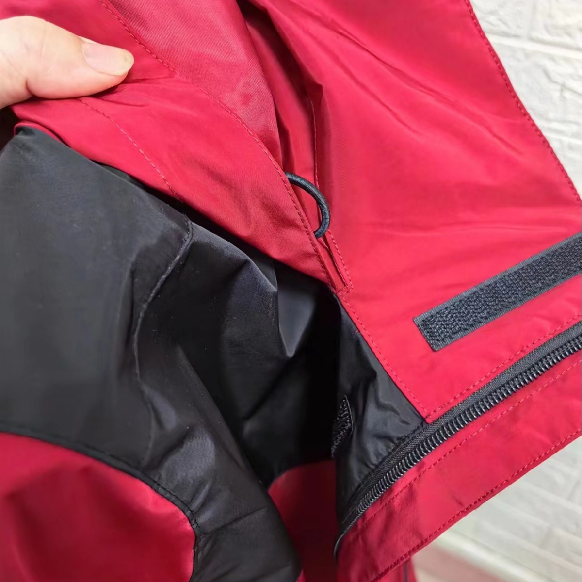 Factory-made winter and autumn outdoor couple clothing - waterproof and windproof hooded overcoat for men, suitable for travel and mountain climbing, with zipper closure.