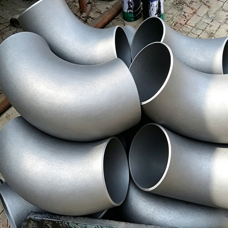 Seamless push-formed carbon steel elbow