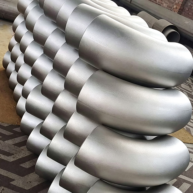 Seamless push-formed carbon steel elbow