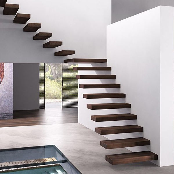 Floating cantilever staircase structure with wooden steps supporting the building