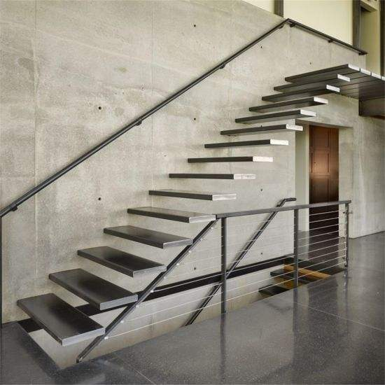 Floating cantilever staircase structure with wooden steps supporting the building