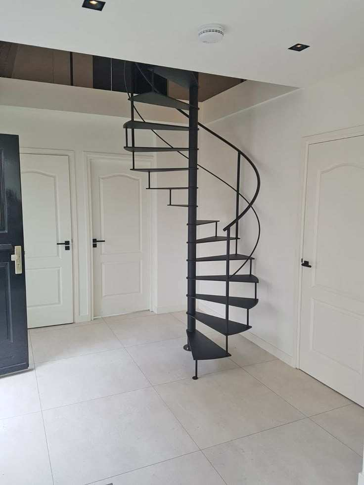 Minimally modern spiral staircase with glass railing, indoor use, steel wood structure