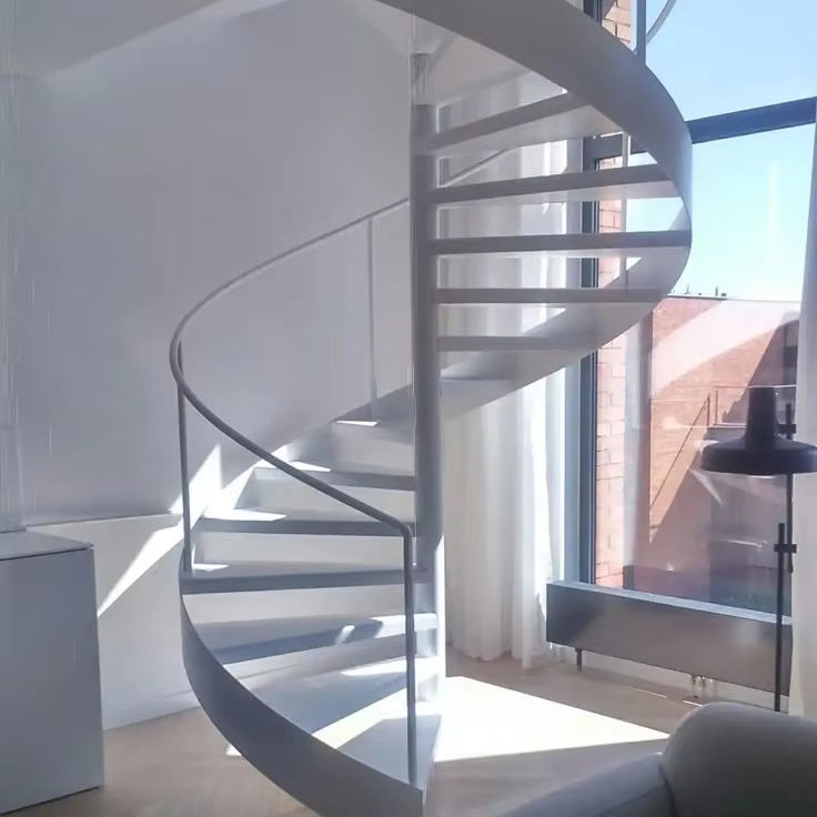 Floating heavy-duty spiral staircase with glass railing, traditional steel wood structure indoors