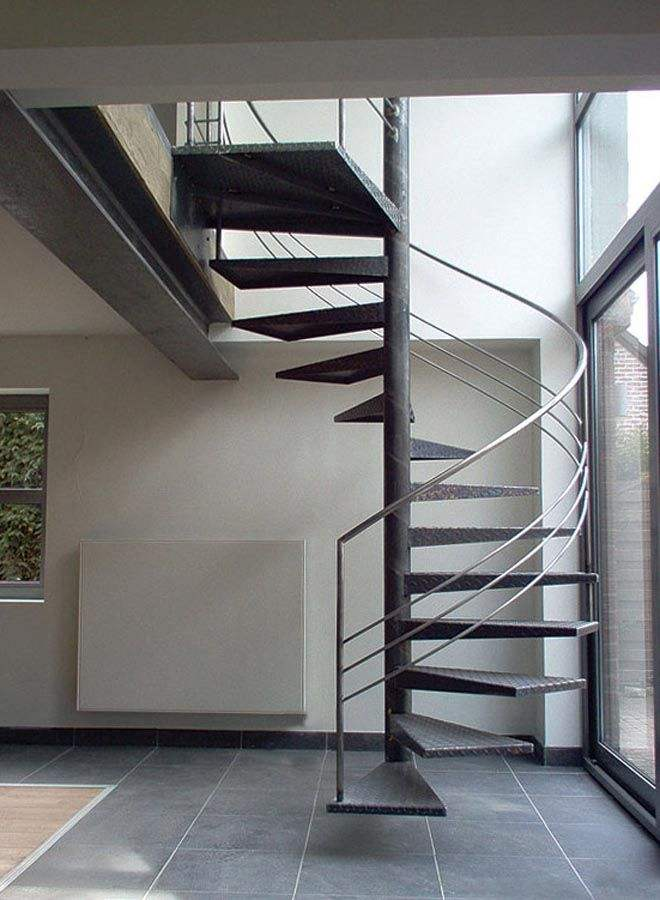 Floating heavy-duty spiral staircase with glass railing, traditional steel wood structure indoors