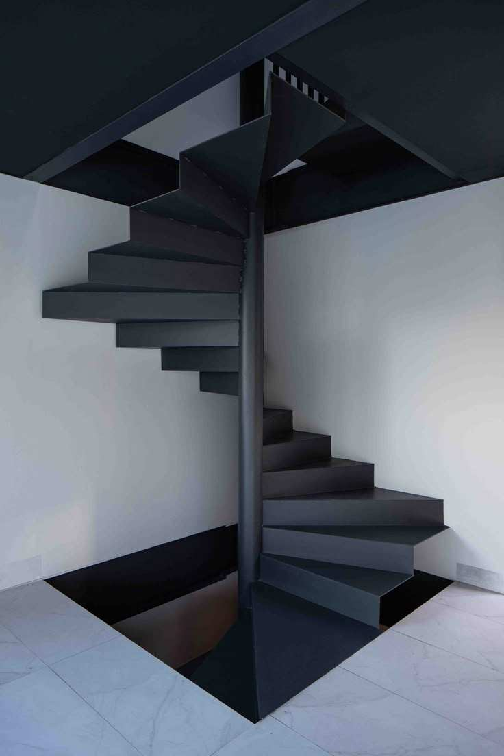 Floating heavy-duty spiral staircase with glass railing, traditional steel wood structure indoors