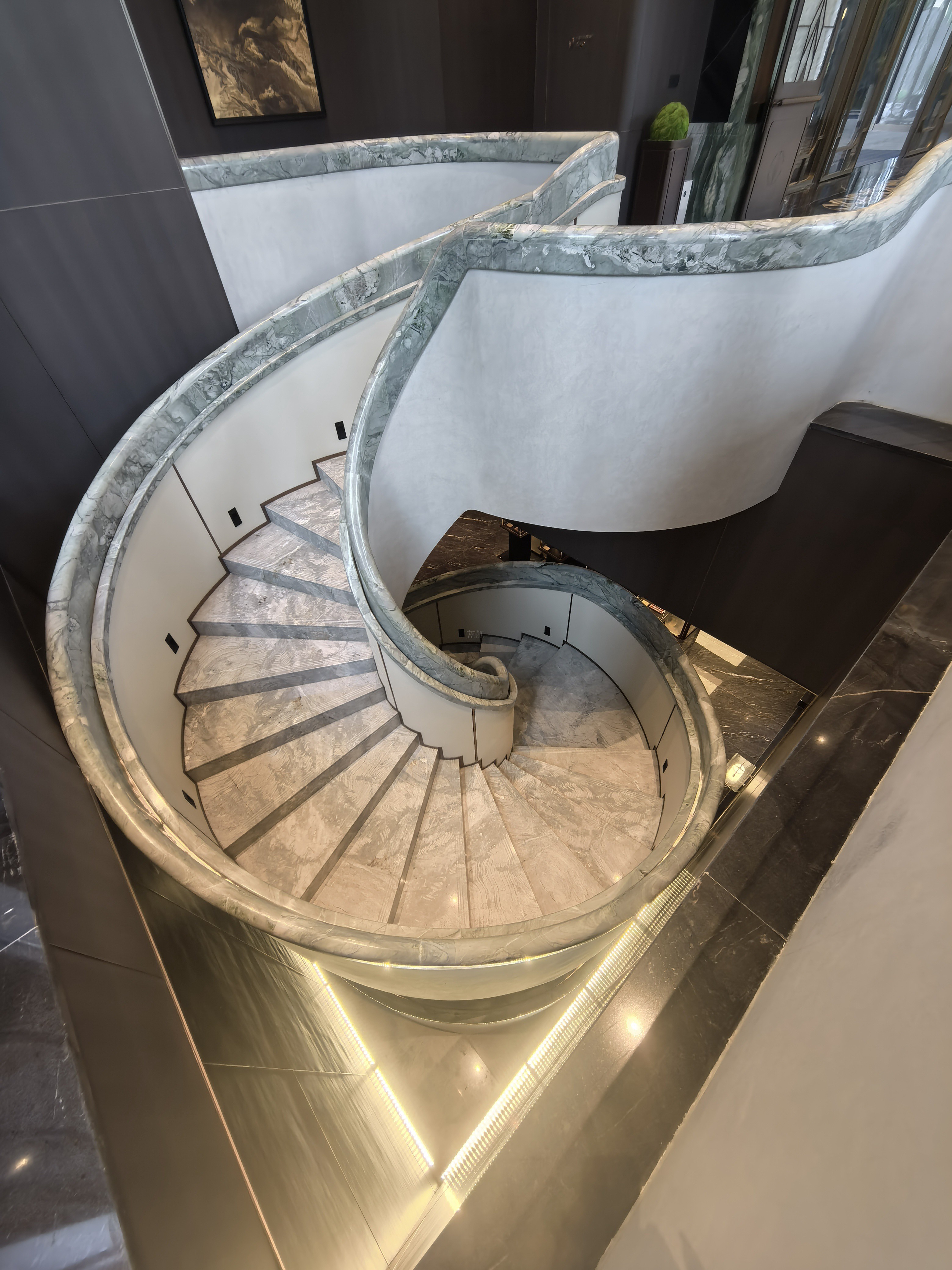 Curved marble staircase top view in private villa