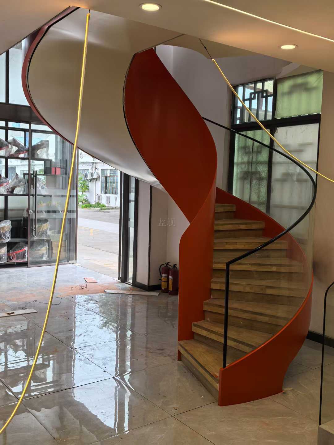Red sculptural helical staircase art installation