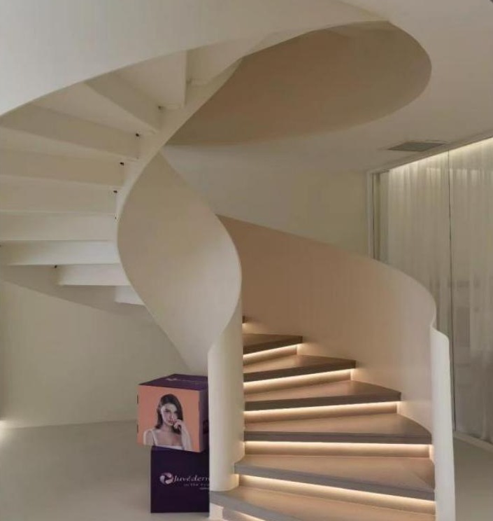 Warm White Curved Staircase with LED Lighting