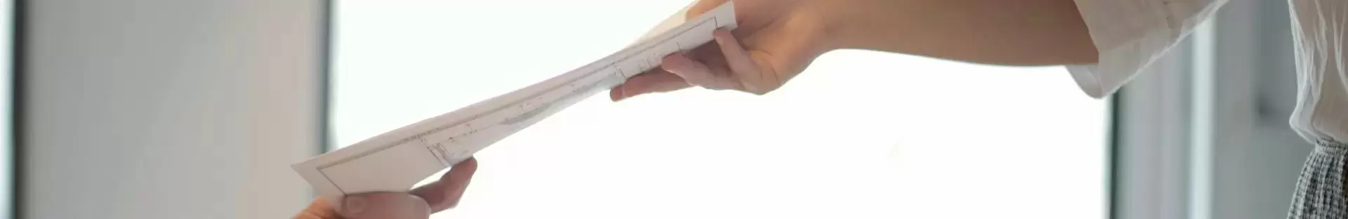 peopel handing files to another people