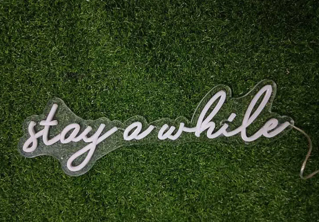 Stay a while neon sign