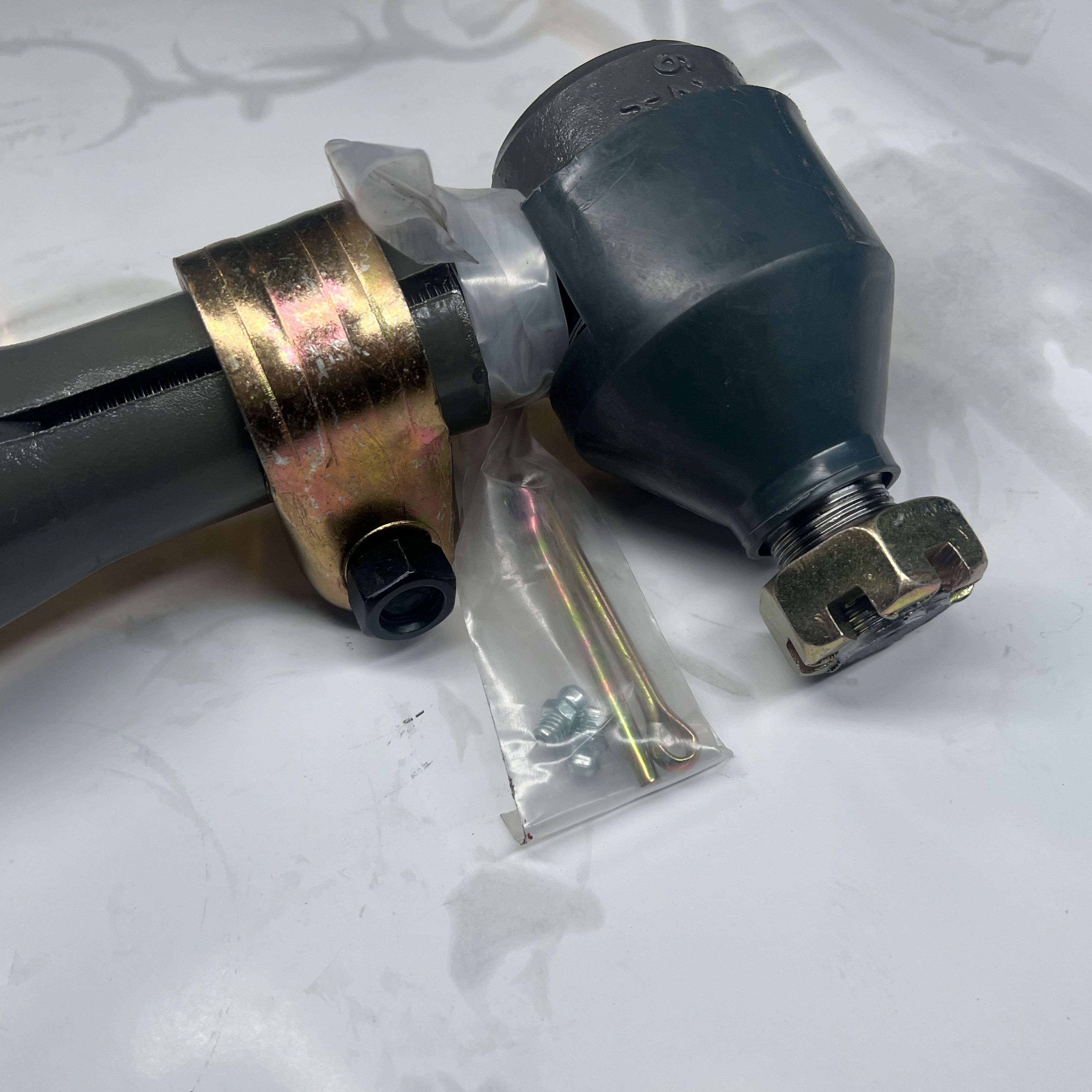 Cross beam steering bridge tie rod