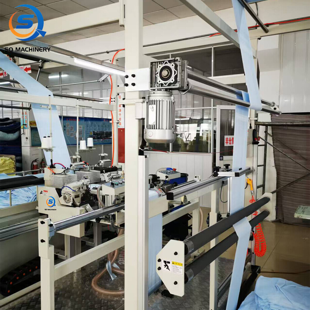 TERRY TOWEL LENGTH HEMMING MACHINE WITH FOLDED LABEL ATTACHMENT