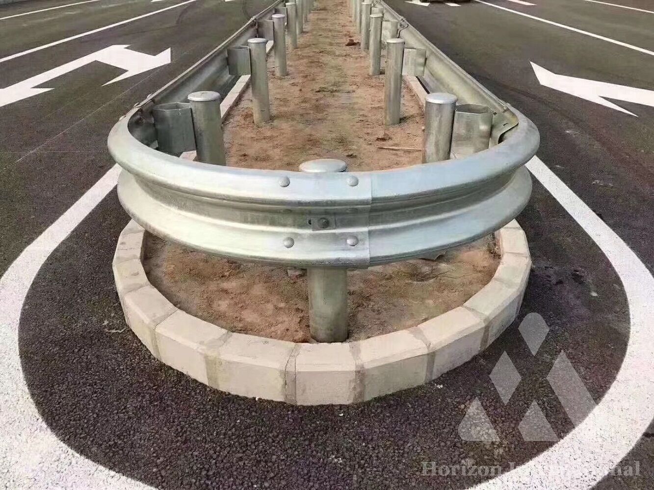 Highway safety barrier median terminal end