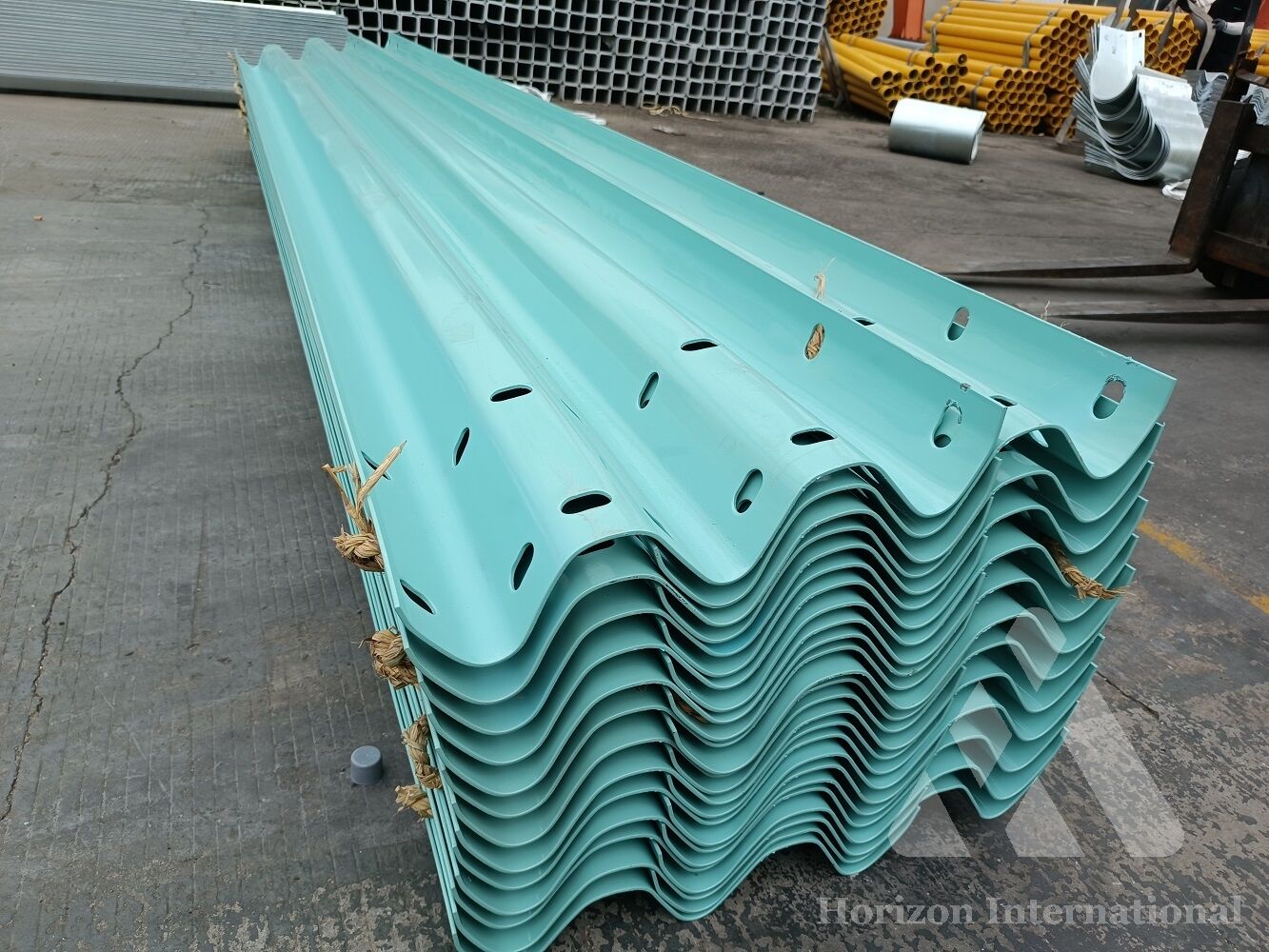 Plastic coated highway safety barrier