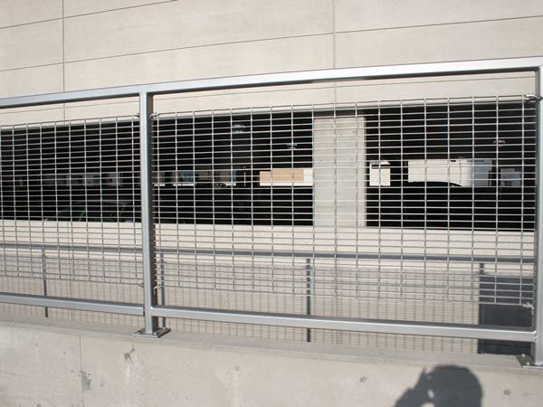 Several pieces of aluminum swage locked gratings are welded at the frame as security fences..jpg