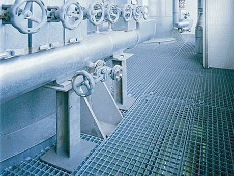 A serrated press-locked steel grating used as a platform in the industry..jpg