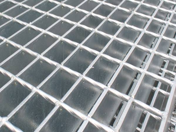 Several pieces of steel grating with plain surface on gray background..jpg