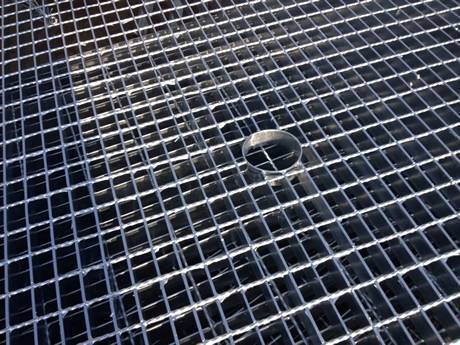 There is steel grating with a small hole in the middle..jpg