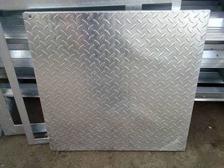 A compound steel grating show us the checkered plate side..jpg