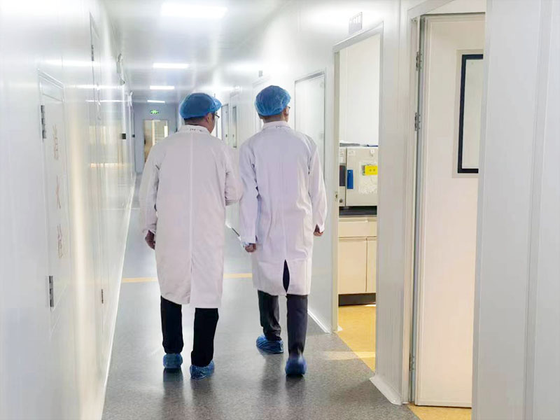 Visiting the lab of our cooperated pharmaceutical factory. 