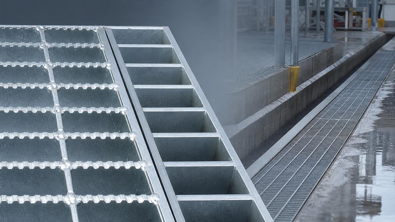Which is safer, serrated or smooth surface steel grating?
