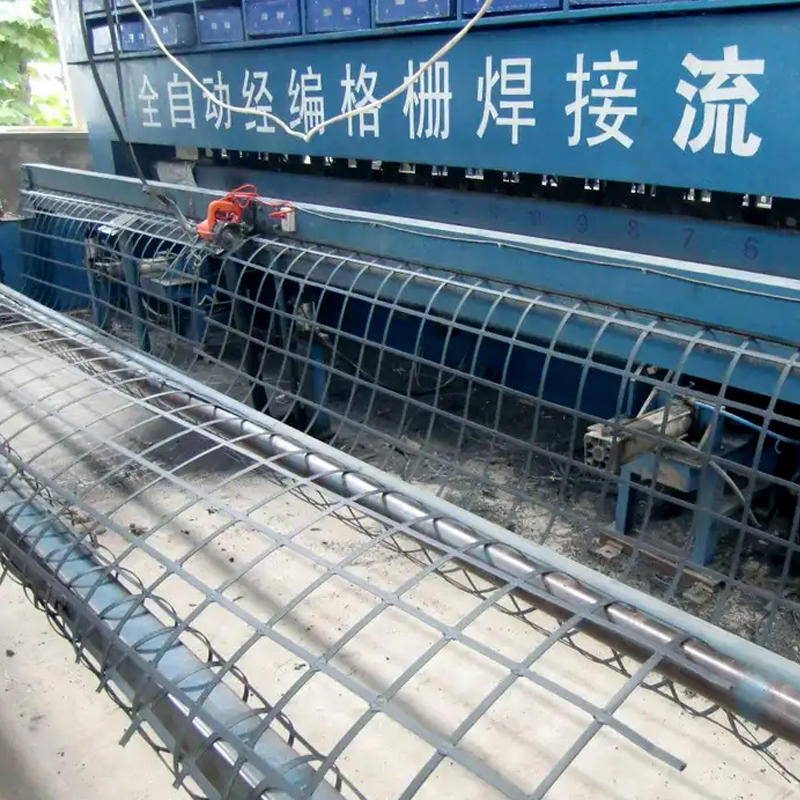 Roadbed anti-cracking reinforcement bi-directional tensile steel-plastic geogrid
