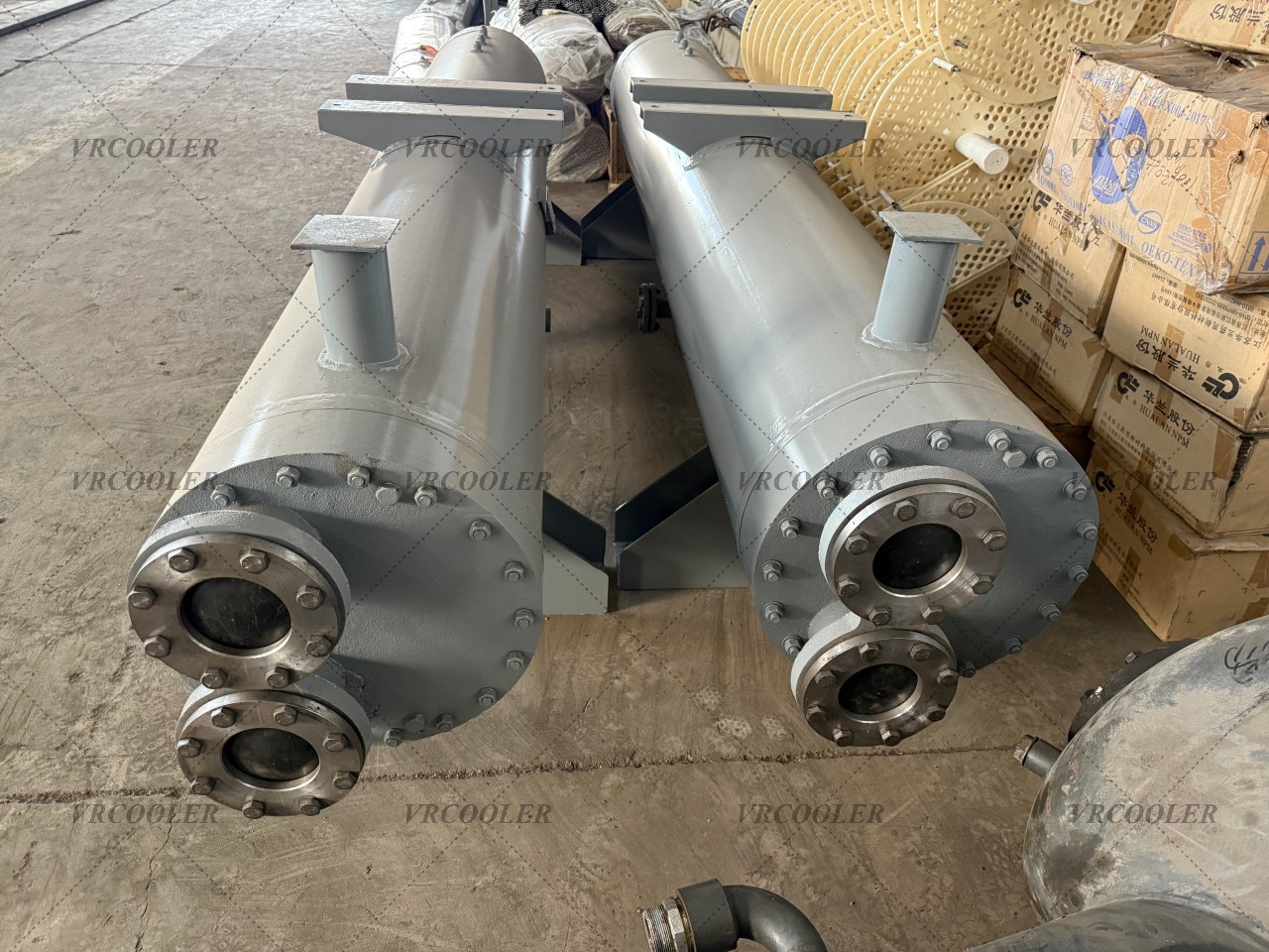 What is the difference between a dry-expansion evaporator and a flooded evaporator?