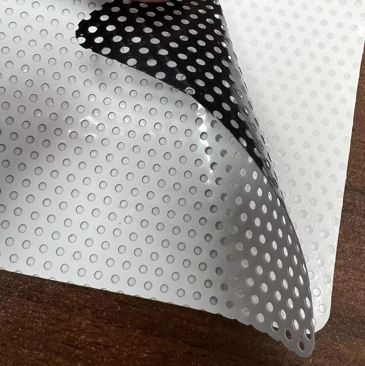 Tri-layer one way vision vinyl 