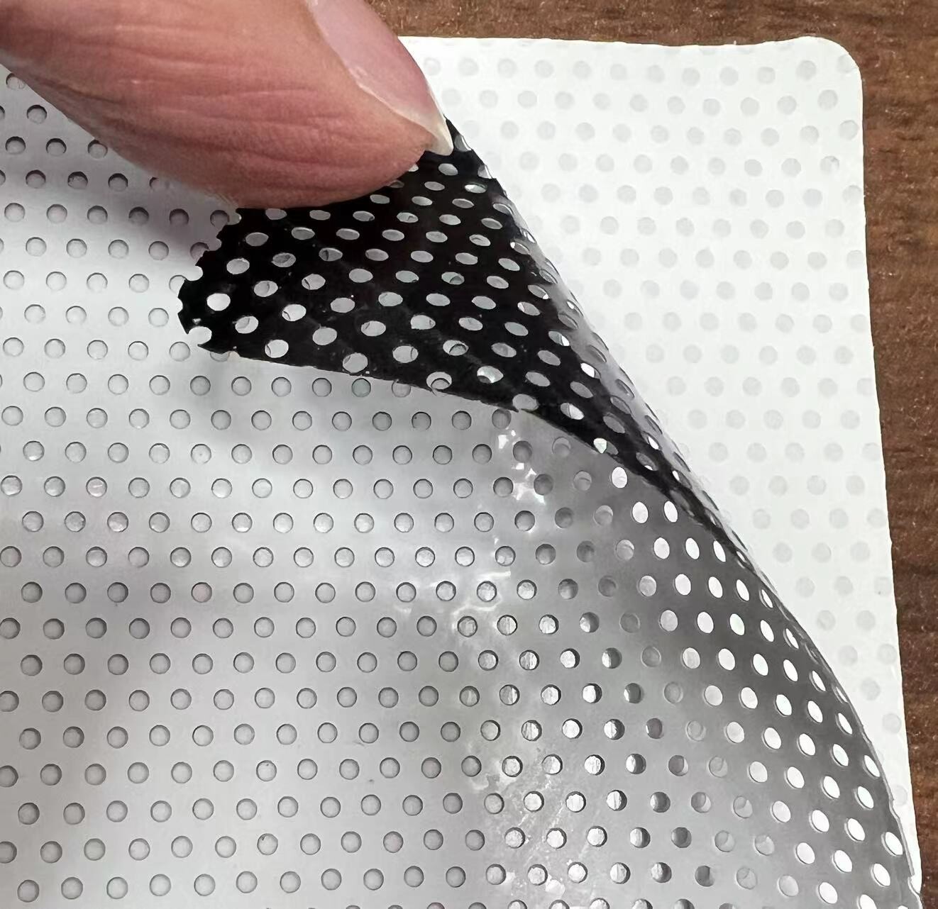 Tri-layer one way vision vinyl 