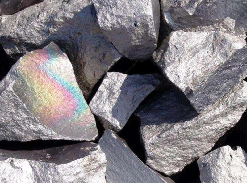 The process of attaching ore particles to air bubbles