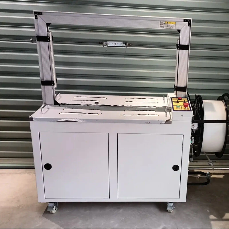 Automatic carton strapping machine