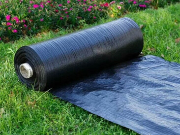 Why are more and more orchards using grass-proof cloth?