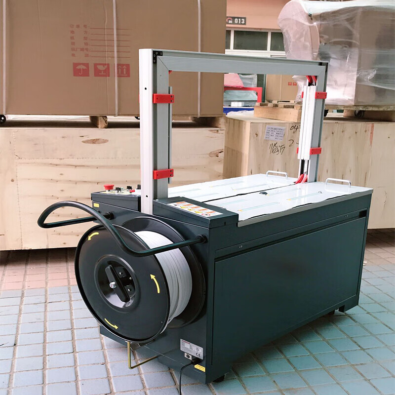 Automatic carton strapping machine
