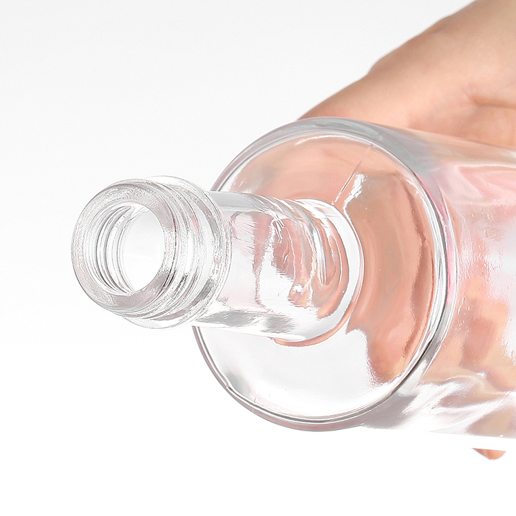 Glass round bottle with screw top