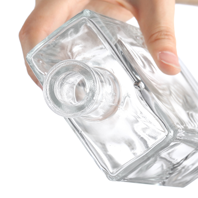 Tall rectangular glass bottle