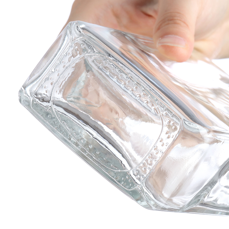 Tall rectangular glass bottle