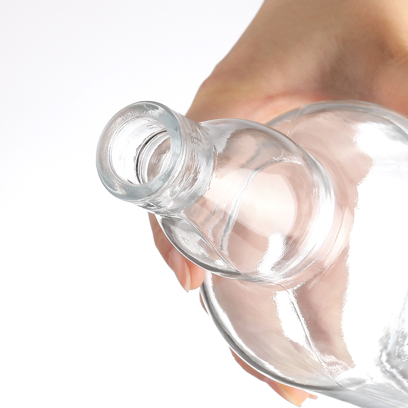 Thick bottom curved neck whiskey bottle