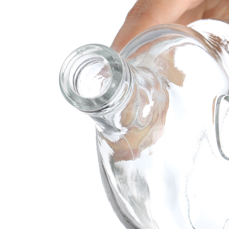 Embossed brandy bottle with gold lid