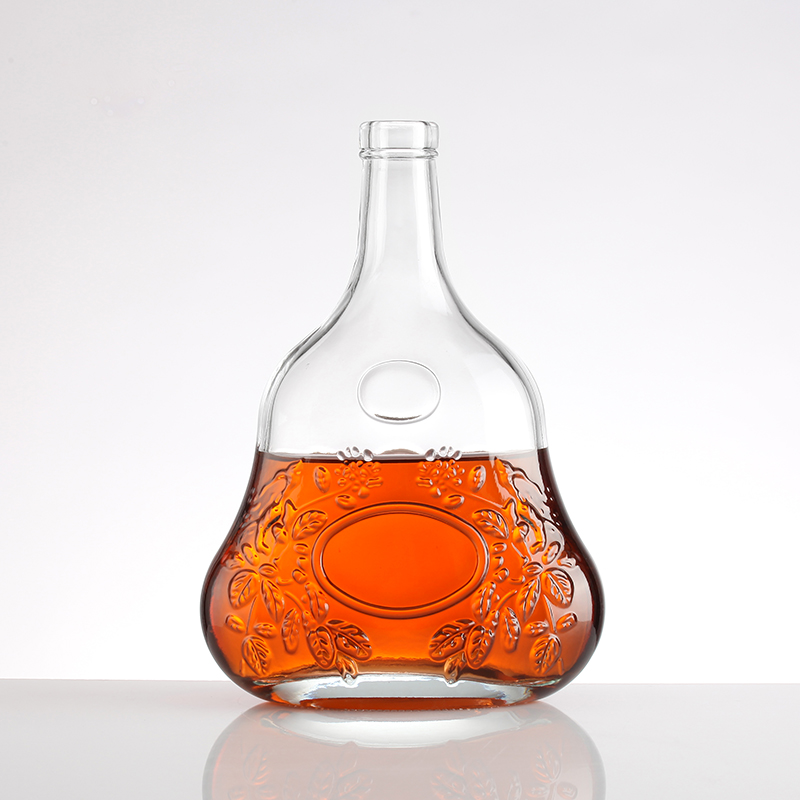 Embossed brandy bottle with gold lid