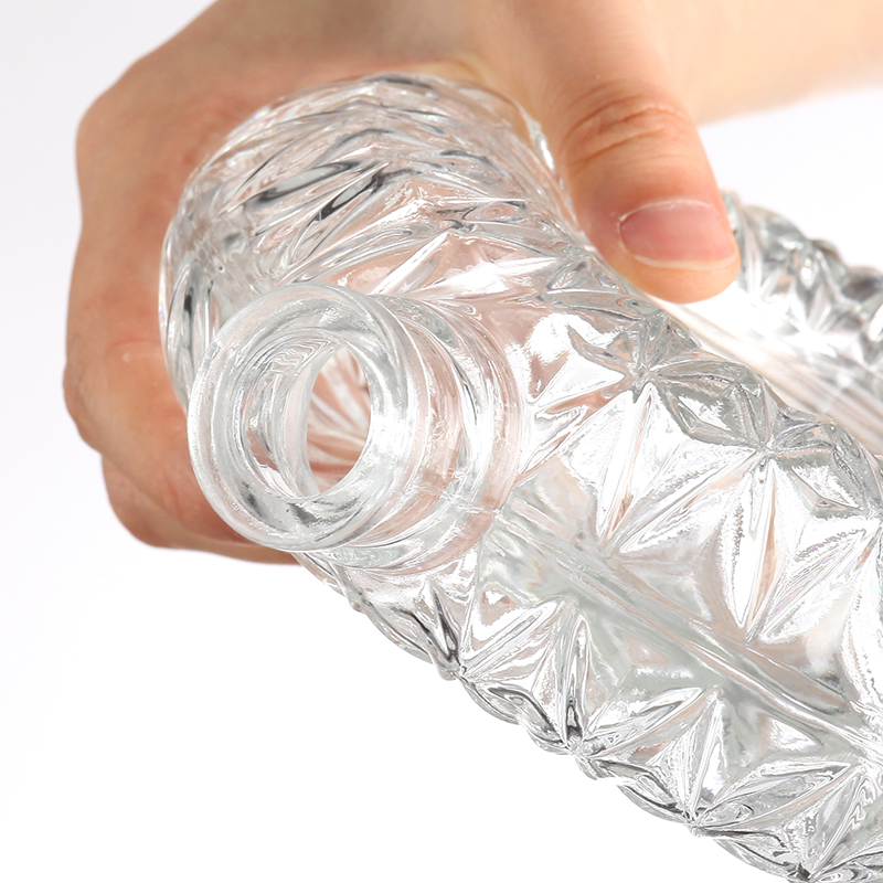 Round glass bottle with intricate pattern