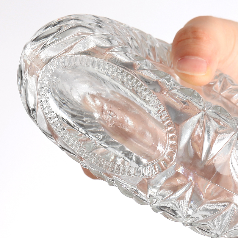 Round glass bottle with intricate pattern