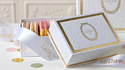 gold foil and embossed logo macaron box