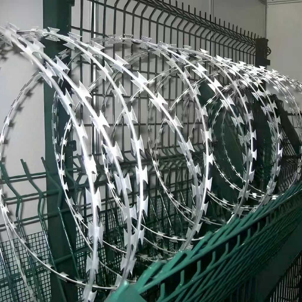 Razor Wire 246 ft. Galvanized Barbed Wire Razor Ribbon Barbed Wire . Garden Fence