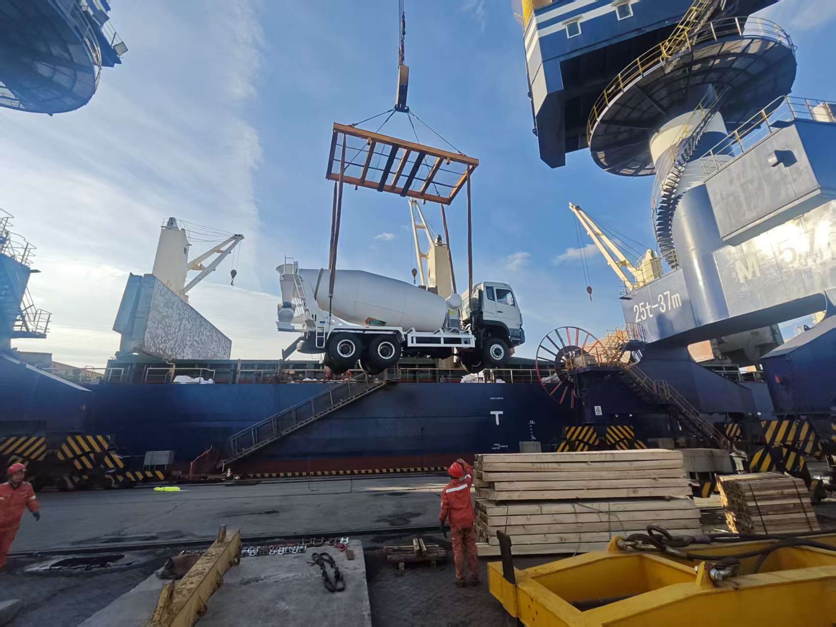 Concrete mixer trucks loading in Guyana