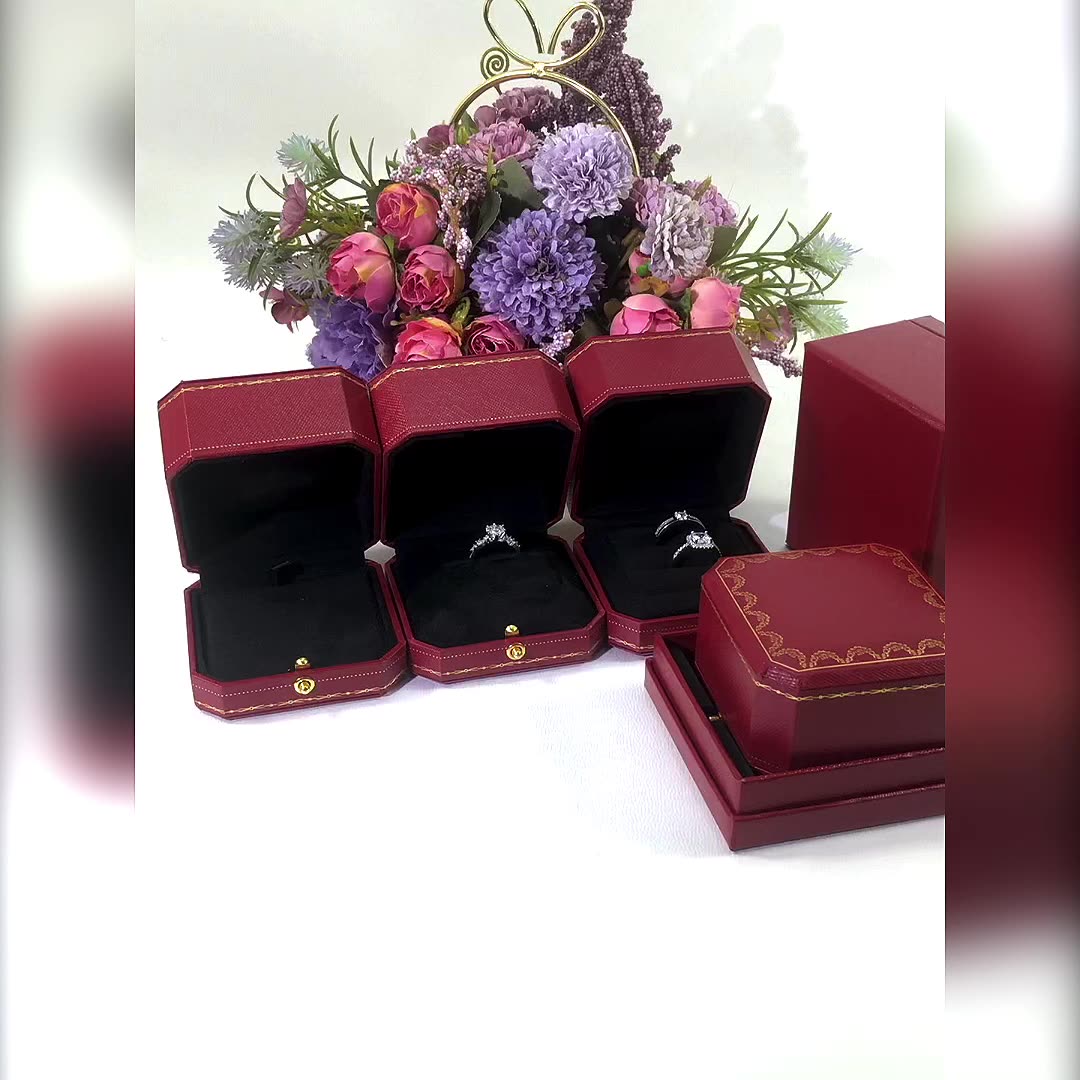 Red jewelry box for proposing with a diamond ring