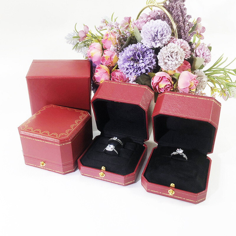 Red jewelry box for proposing with a diamond ring