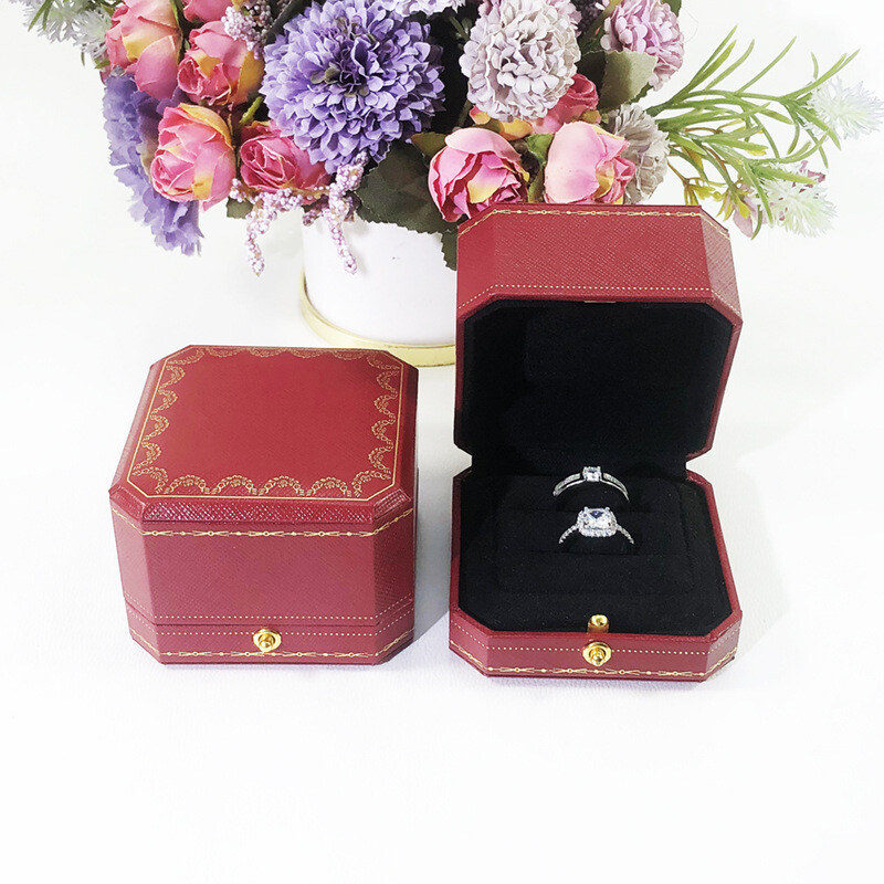 Red jewelry box for proposing with a diamond ring